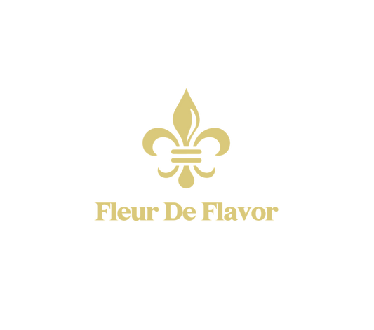 Fleur De Flavor Gift Card logo featuring a gold fleur-de-lis symbol and elegant serif text. Ideal for gifting bakers and flavor lovers.